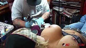 Shyla Stylez gets tatted while playing with her tits